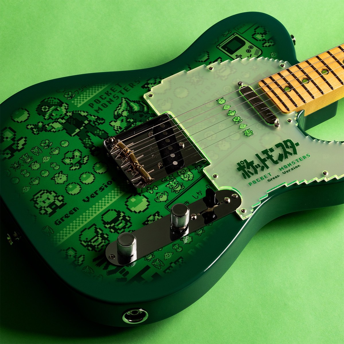 Thân đàn Fender Pokémon Green Version Telecaster với đồ họa pixel art và pickguard trong mờ