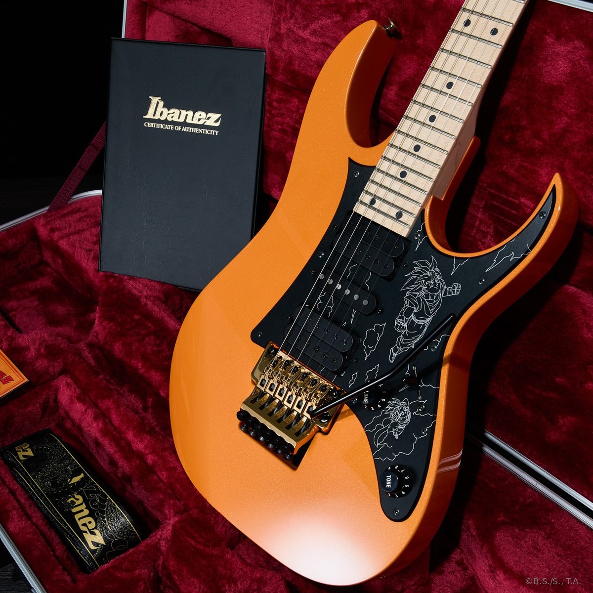 Ibanez RGDBZ Dragon Ball Z trong hộp cứng lót nhung đỏ, cạnh bìa Giấy chứng nhận Ibanez và dây đeo